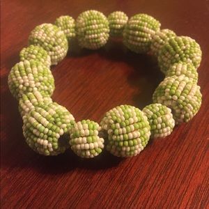 Green and white beaded bracelet